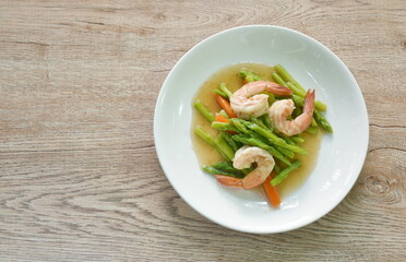 stir fried asparagus and carrot with shrimp in oyster sauce on dish