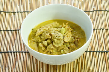 spicy boiled split grill mushroom with roasted mackerel fish and Nitta tree seed or luk rieng in coconut milk curry soup Thai southern food on bowl 