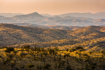 Fototapeta na wymiar Sunrise over the rolling hills of the Khomas Hochland, Namibia