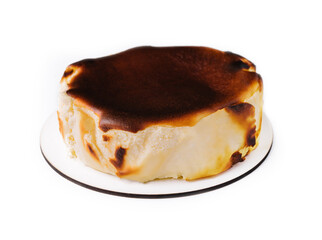 San sebastian cheesecake on plate isolated