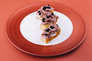 bruschetta with boiled pork and truffle sauce