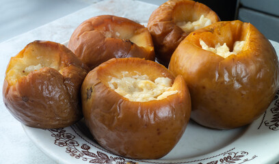 Baked apples with honey on the table