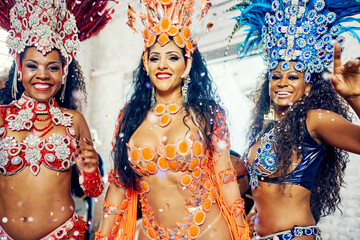 Women, carnival and new year party in brazil, celebration and colorful costume, festival and dance. Friends, dancer and samba in Rio de Janeiro together with culture, celebrate and salsa event