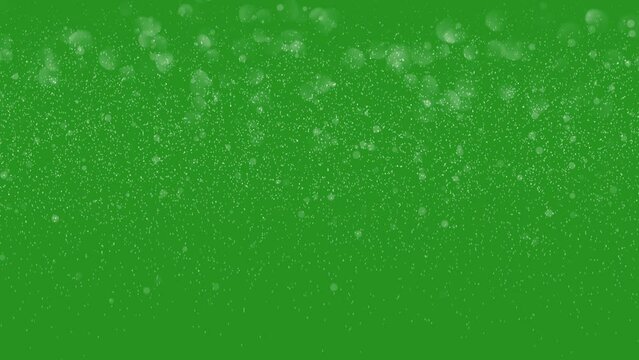 Falling snow isolated on green. Loop 4k, Chroma key. High quality 4k footage