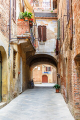 Fototapeta na wymiar Backstreet in an Italian village with houses