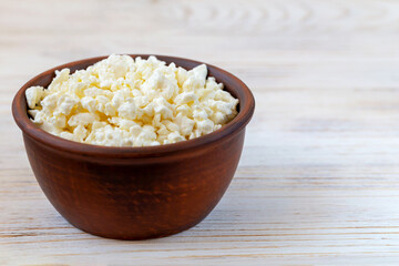 Fresh delicious white cottage cheese in a bowl close-up