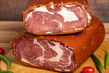 Turkish pastrami on wooden background. Antrikot is bacon made by drying with various spices and salt. Turkish cuisine delicacies