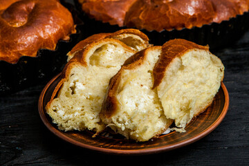 Fresh bread from the oven. Traditional cheese pie from Romania called Saralie. Homemade bread made from white wheat flour.