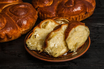 Fresh bread from the oven. Traditional cheese pie from Romania called Saralie. Homemade bread made from white wheat flour.