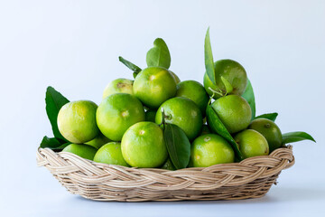 Fresh green oranges in basket , Fresh green oranges at market and shop for sell..Fresh green lemons, in basket , Fresh green lemons at market and shop for sell.