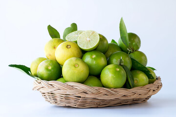 Green lemon in rattan basket for sell at market and supermarket.