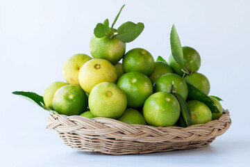 Fresh green oranges in basket , Fresh green oranges at market and shop for sell..Fresh green lemons, in basket , Fresh green lemons at market and shop for sell.