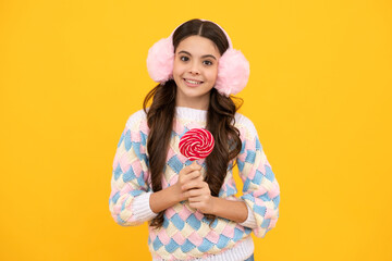 Teenage girl with lollipop, child eating sugar lollipops, kids sweets candy shop.