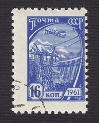 Standard postage stamp The plane flies over the hydroelectric power plant and over support high voltage, stamp USSR 1961