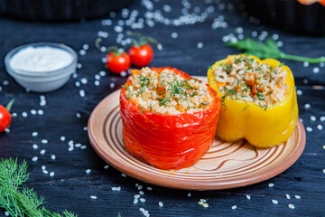 Stuffed pepper. Stewed pepper  with rice and minced meat. Baked peppers in a cast iron pan on a...