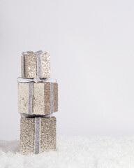 Gift boxes on snow . Winter scene. Holiday concept design. New Year celebration December time. Shopping Christmas  time