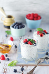 Greek yogurt in glasses with berries and quinoa	