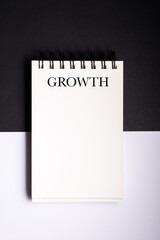 Spiral binder notebook mock up on black and white background. concept of growth