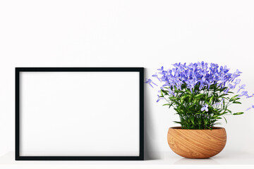 Mockup poster and violet flowers in a pot