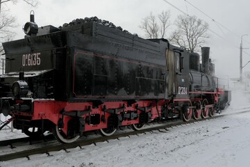 Fototapeta na wymiar Steam locomotive at the New Peterhof station, St. Petersburg, Russia, December 8, 2022