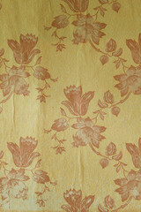 Old torn wallpaper on the wall.Old wallpaper for texture or background.