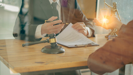 Hammer, judge, lawyer, businessman, scales, god of justice, laptop notebook on table, legal advisor concept Judge with justice lawyers having team meeting at office background