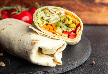 kebab wrap vegetarian vegetables stuffing fresh healthy meal food snack on the table copy space...