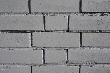 gray brick wall background. textured surface of grey painted brick wall. 