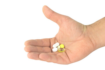 pills in outstretched hand isolated from background