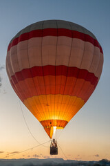 Fototapeta premium Air balloon in the evening sky. Upright photo.