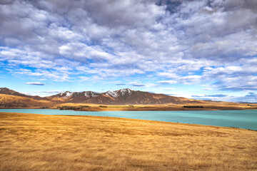 Beautiful view along the Godley Peaks Road to the Adrians Place, Canterbury, New Zealand, South Island. Stunning Southern Alps can be seen along the scenic route.