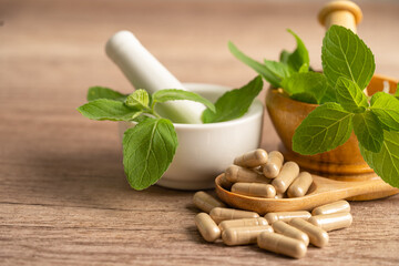 Alternative medicine herbal organic capsule with vitamin E omega 3 fish oil, mineral, drug with herbs leaf natural supplements for healthy good life.