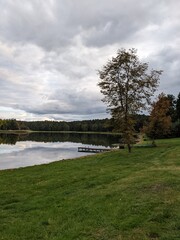 picturesque lake view with small bridge and reflections