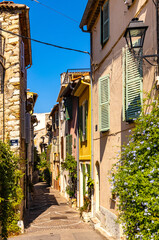 Rue des Revennes street with colorful vintage houses in historic old town of Antibes resort city onshore Azure Cost of Mediterranean Sea in France