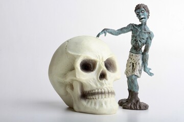 miniature figurine of a zombie doll on a white background