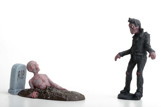 miniature figurine of a zombie doll on a white background