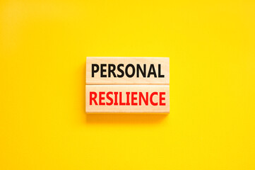 Personal resilience symbol. Concept word Personal resilience typed on wooden blocks. Beautiful yellow table yellow background. Business psychological and personal resilience concept. Copy space.