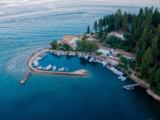 Aerial drone ultra wide photo of famous small port and fishing village of Kouloura with turquoise...