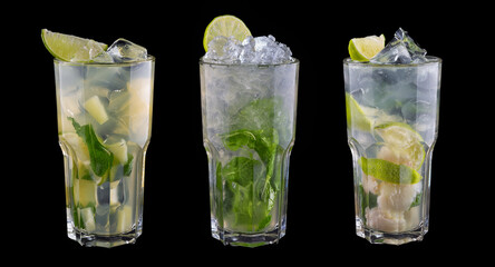 Alcoholic cocktails with mint and lime. Isolated on black