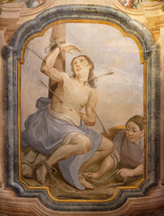 CHIAVENNA, ITALY - JULY 20, 2022: The fresco of St. Sebastian in the church San Lorenzo by  Filippo...