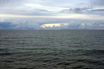 Landscape on the sea with early sunset beginning with calm water continues till beautiful heavy...