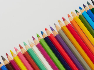 Colored pencils background. Colored pencils on a white background.