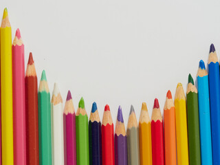 Colored pencils background. Colored pencils on a white background.