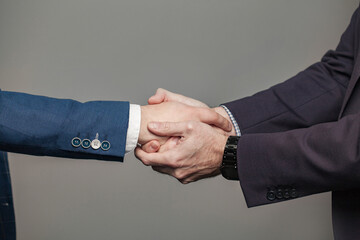 Business people in suit shaking hands, completed deal concept