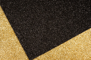 Fototapeta premium Luxury abstract glitter background in golden and black colours with copy space. Minimal fashionable style backdrop. Festive background