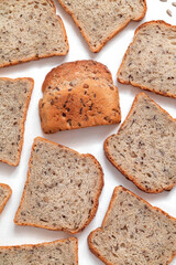 Fresh whole grain toast bread close up on a white background. Top view. Healthy eating concept.