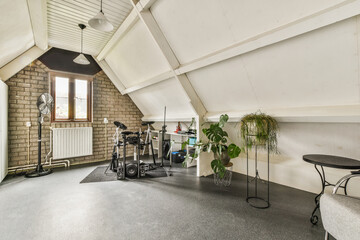 Spacious study room with table and musical instruments