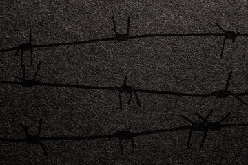 International Holocaust Remembrance Day. Barbed wire on a black background with place for text....