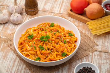 Spicy Shrimp Spaghetti with Tomato Sauce in white plate,linguine pasta
