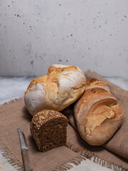 Freshly baked bread on grey concrete background. 